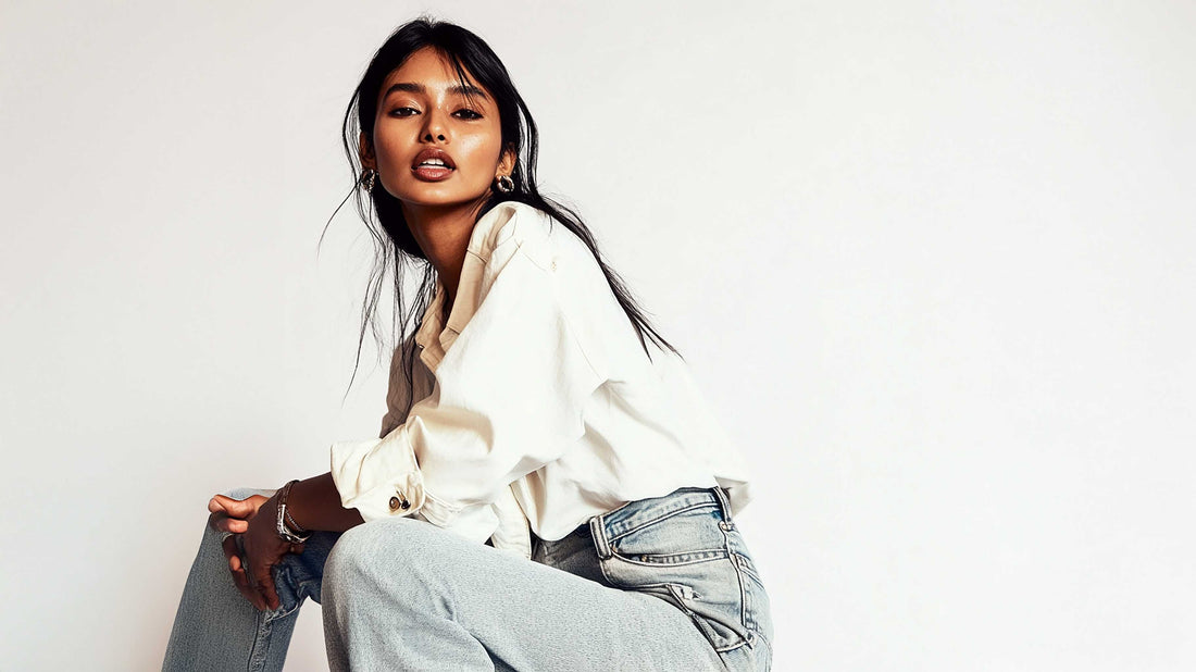 Woman in a cream shirt and light denim, a simple winter layering base